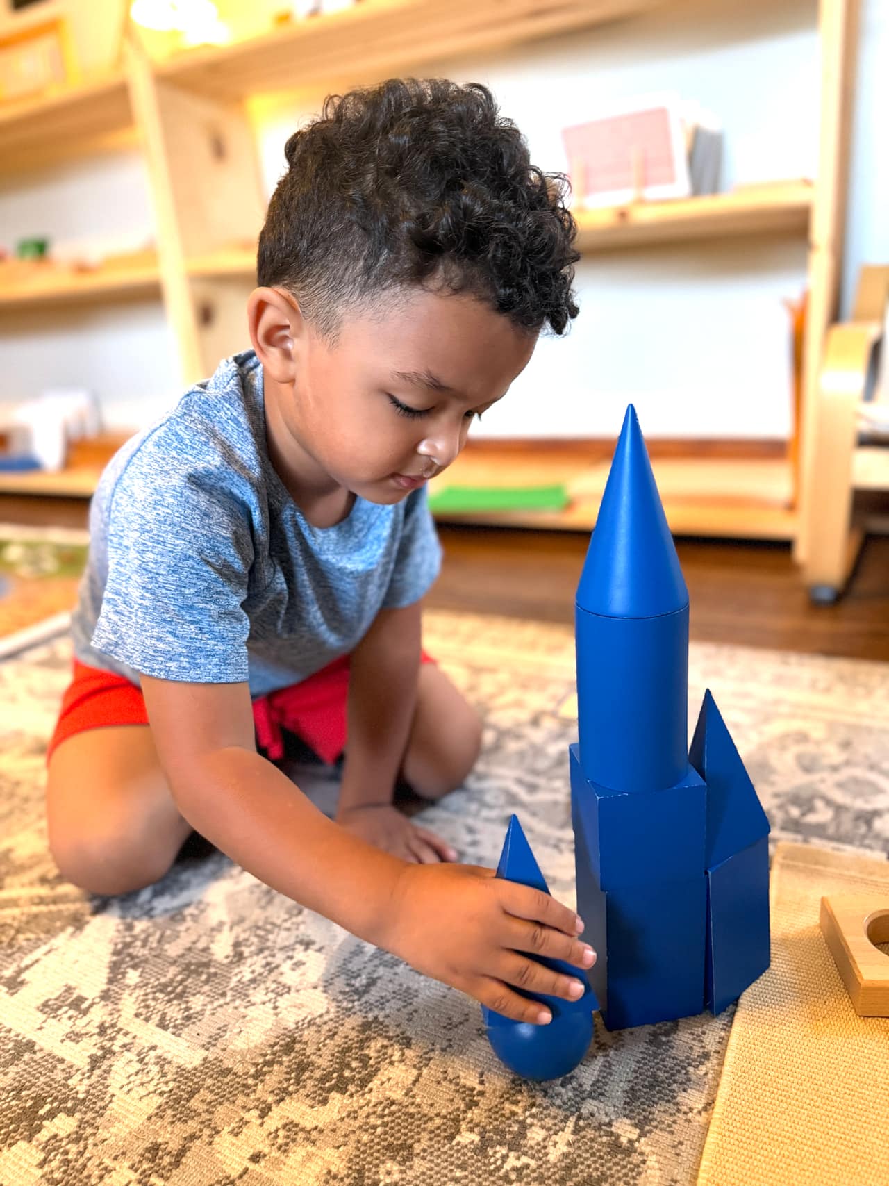 A child focused on Montessori work