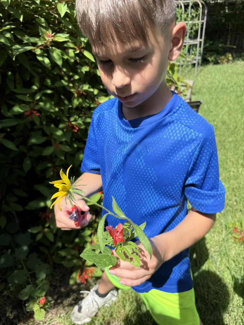 A child exploring nature at Bayou Blossoms